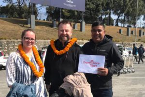 tourists-with-colorful-prayer-flags-in-tibet