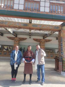 tourists with local guide in traditional dress tibet