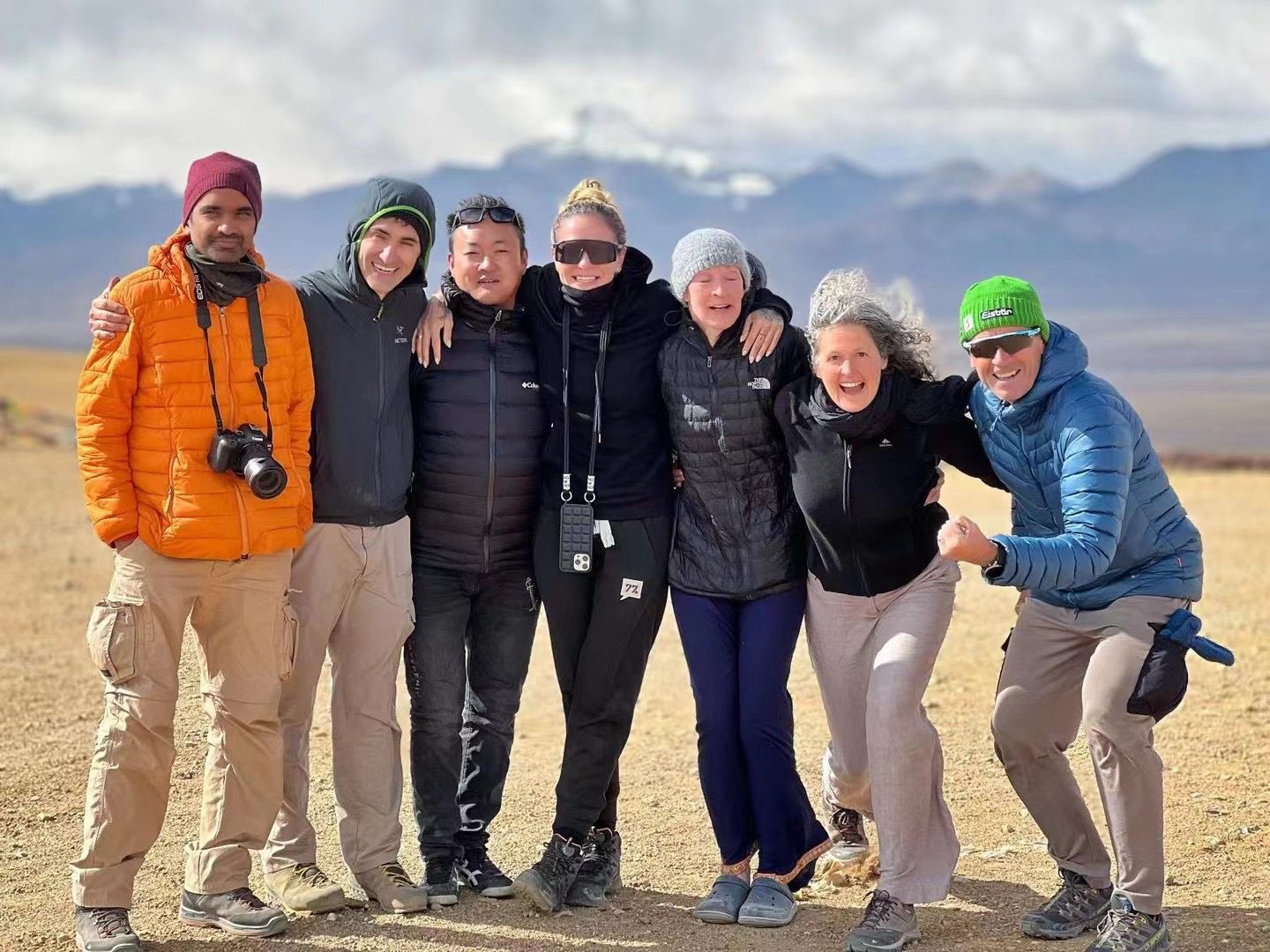 Solo Travelers Group Portrait on Tibetan Plateau Landscape International solo travelers group portrait on Tibetan plateau with mountain scenery