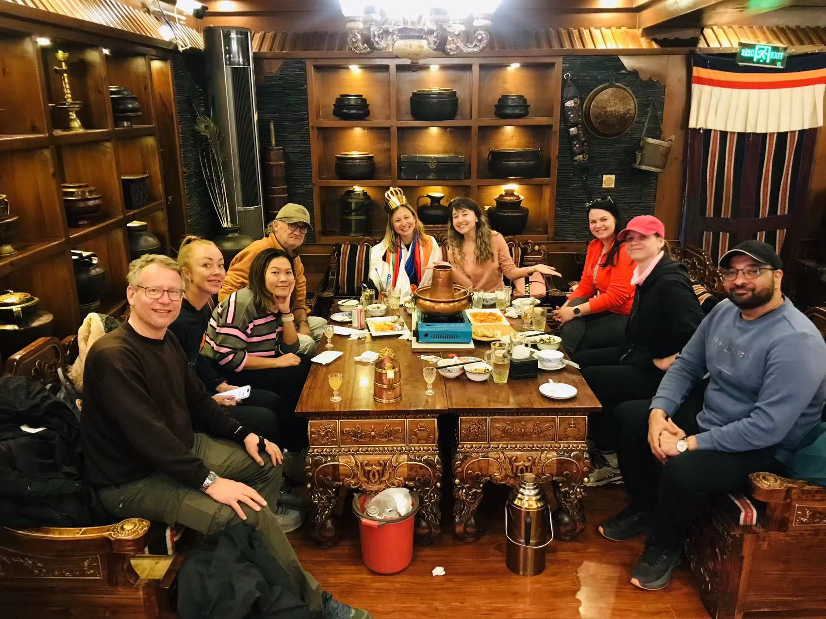 Solo Travelers Group Dinner in Lhasa Traditional Tibetan Restaurant SSolo travelers group dining together in traditional Lhasa Tibetan restaurant cultural experience