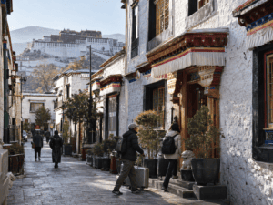 Traditional accommodation in Lhasa Old Town with Potala Palace in the background