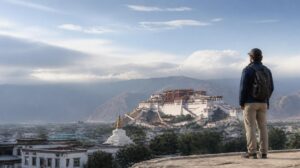 Traveler viewing the Potala Palace in Lhasa during a short Tibet tour